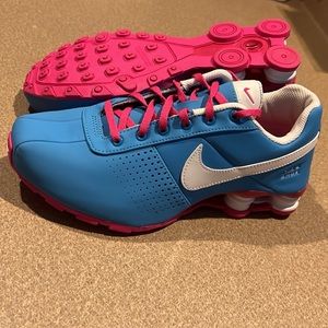 Blue and pink Nike Shox.